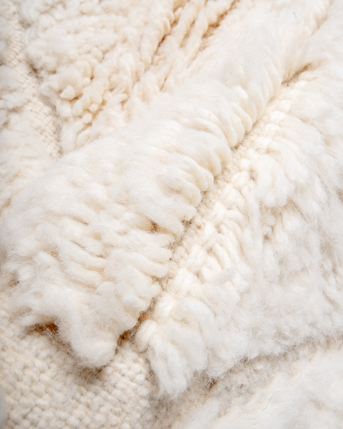 Modern, designer, handcrafted Berber rug from Morocco. Beniourain carpet with minimalist design, natural wool pile and a fluffy texture.